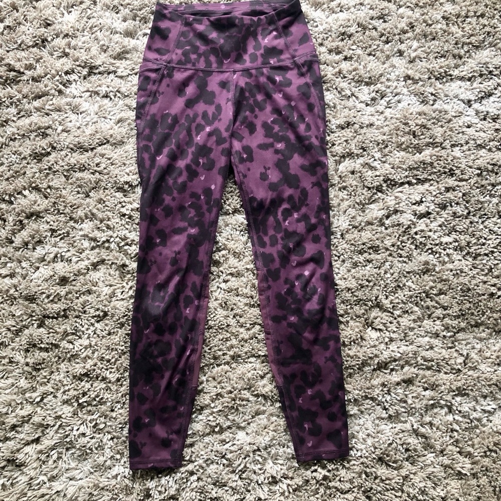Purple cheetah print workout leggings with sheer sides